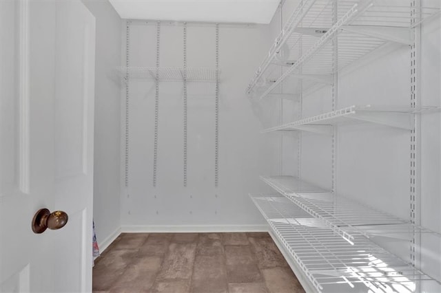 spacious closet with wood finished floors