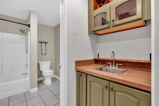 bathroom featuring shower / bath combination, baseboards, toilet, tile patterned flooring, and vanity