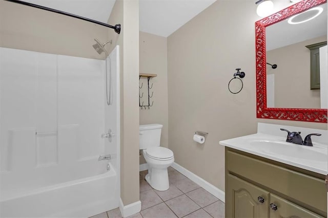 full bath featuring baseboards, toilet, tile patterned floors, vanity, and shower / washtub combination