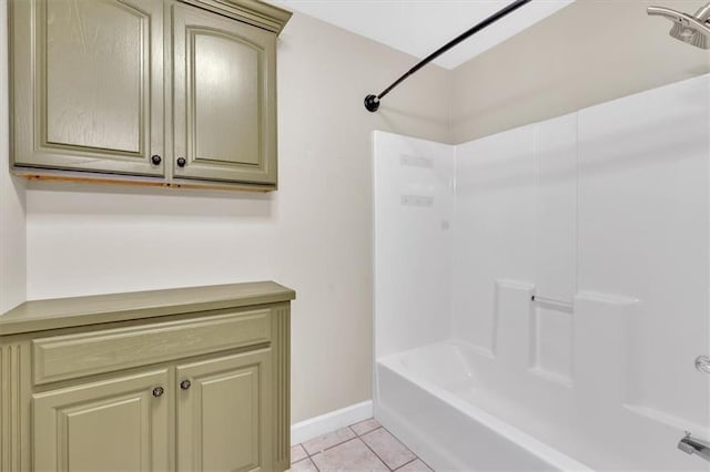 full bathroom with tile patterned flooring, baseboards, and shower / tub combination