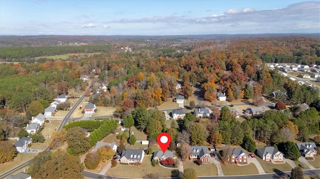 bird's eye view featuring a residential view and a view of trees