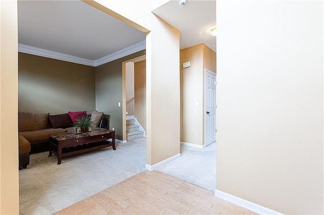 living room featuring light carpet and crown molding