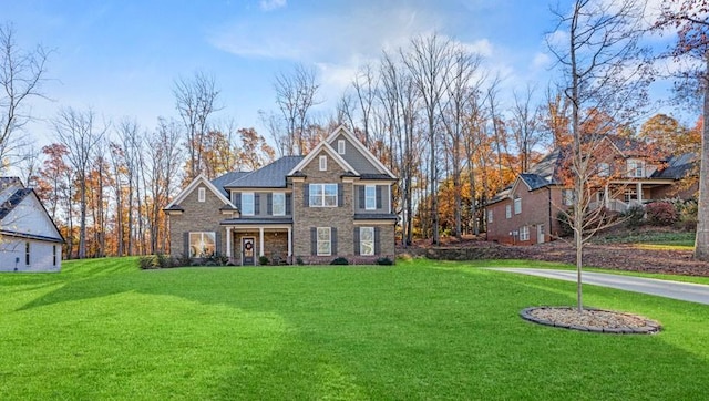 69 Saint Ives Cir, Winder, GA 30680 - view of front of house with stone siding and a front lawn