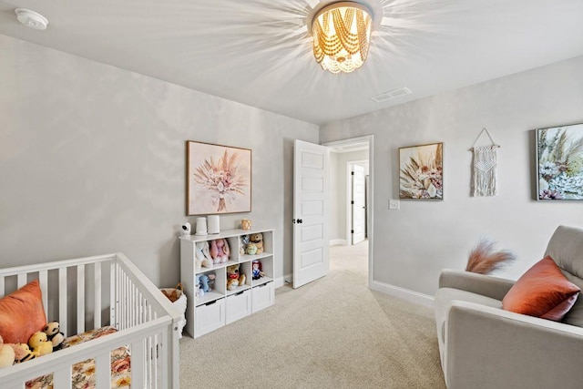 bedroom with baseboards, visible vents, a notable chandelier, and carpet flooring