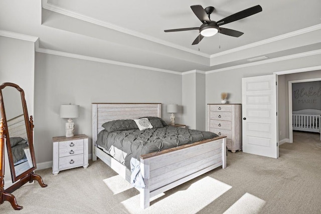 bedroom with carpet floors, a raised ceiling, crown molding, and ceiling fan