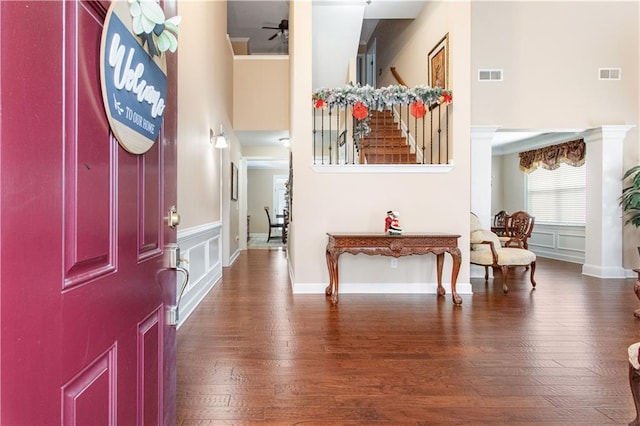 foyer with hardwood / wood-style floors and ceiling fan