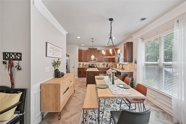 7530 Springbox Dr, Fairburn, GA 30213 - dining space with recessed lighting, crown molding, and wainscoting