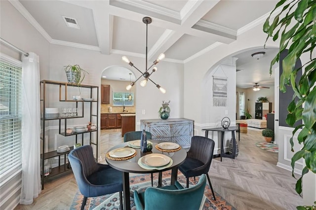 7530 Springbox Dr, Fairburn, GA 30213 - dining room with arched walkways, ceiling fan, coffered ceiling, beam ceiling, and crown molding