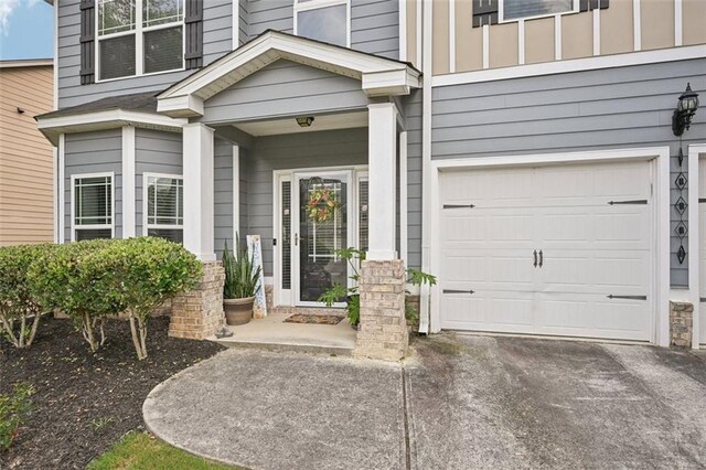 7530 Springbox Dr, Fairburn, GA 30213 - doorway to property with a garage and driveway