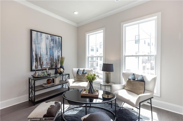 sitting room featuring plenty of natural light, dark hardwood / wood-style floors, and crown molding