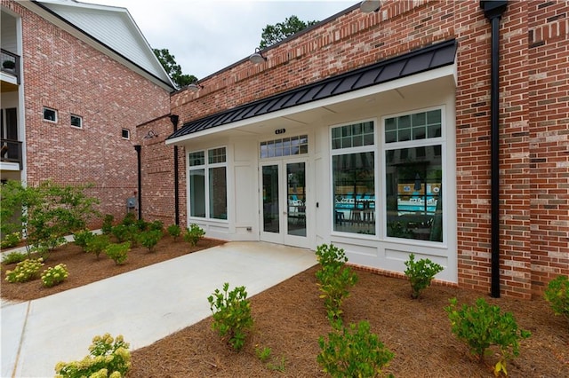 rear view of property featuring french doors and a patio