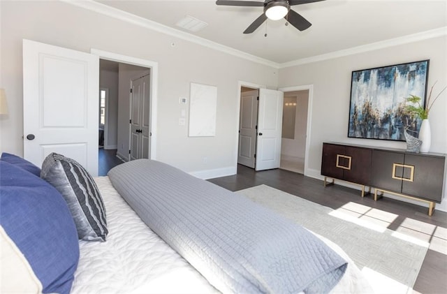 bedroom featuring ceiling fan, crown molding, and dark wood-type flooring