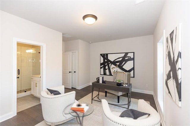 sitting room featuring dark tile flooring