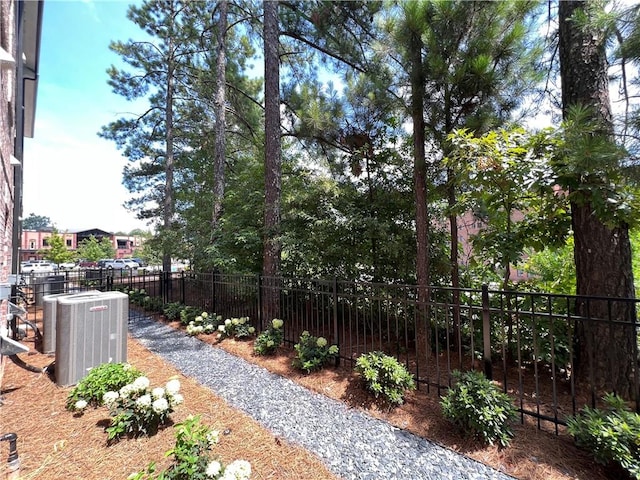 view of yard with central air condition unit