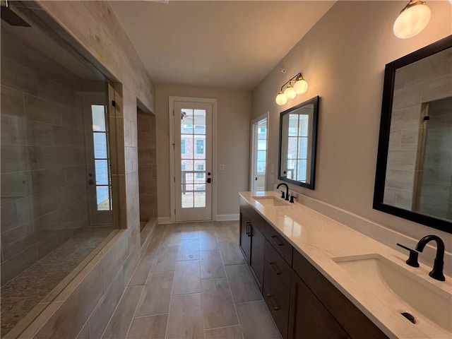 bathroom with double sink, tile floors, and oversized vanity