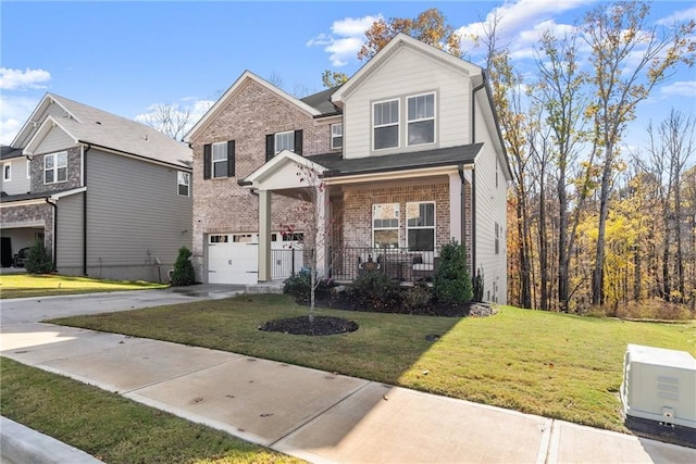 view of property with a front yard, a porch, and a garage