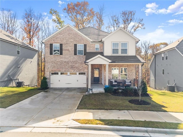 view of front of house with covered porch, a garage, cooling unit, and a front yard