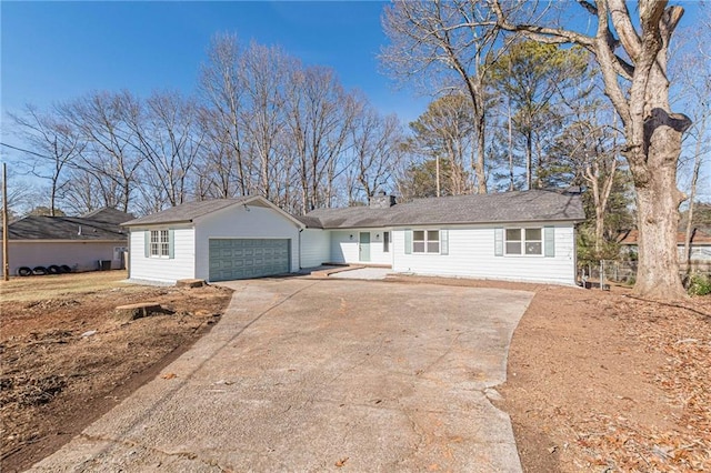 single story home featuring a garage