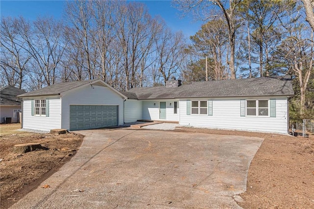 ranch-style house featuring a garage