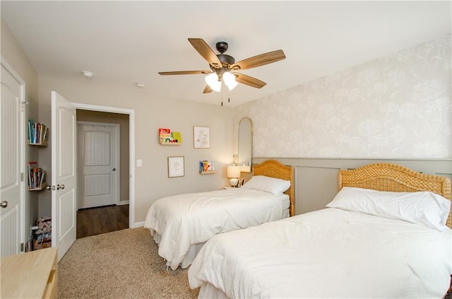 bedroom featuring wallpapered walls and ceiling fan