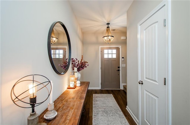 entryway featuring dark wood-style floors and baseboards