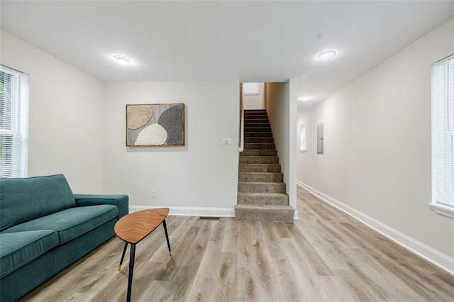 living area with light hardwood / wood-style floors