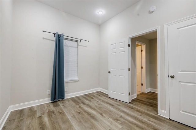 spare room featuring light wood-type flooring