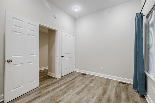 unfurnished bedroom featuring light hardwood / wood-style flooring