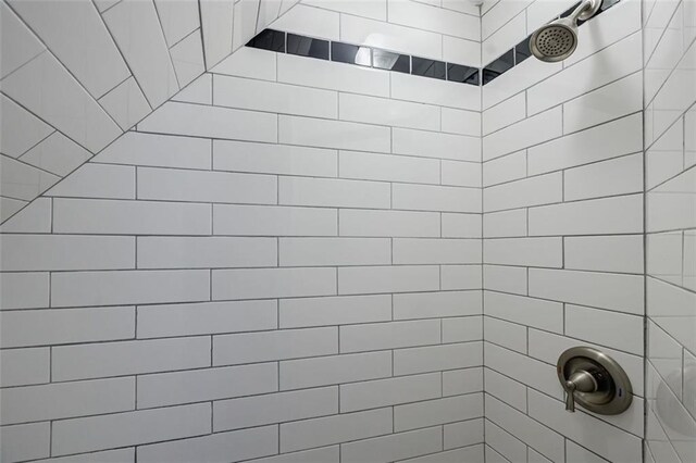 bathroom with tiled shower