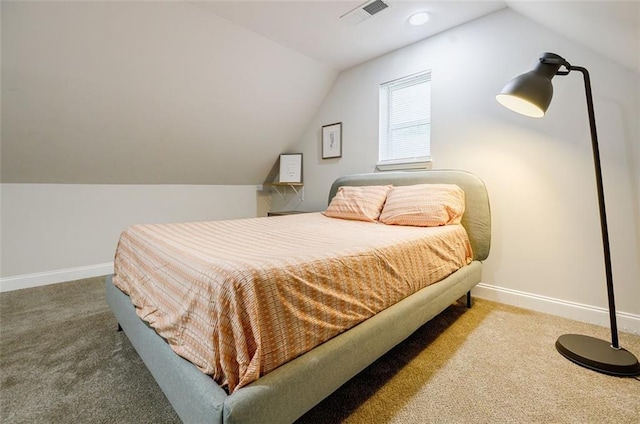 carpeted bedroom featuring vaulted ceiling