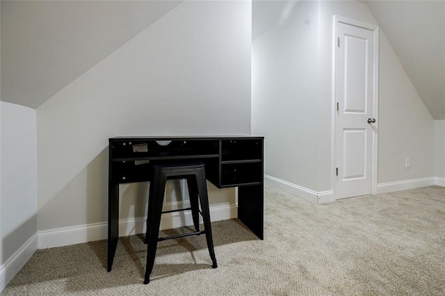 office space featuring carpet and vaulted ceiling