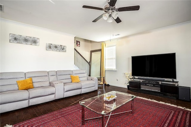 3469 English Elm Way, Loganville, GA 30052 - living area with visible vents, crown molding, ceiling fan, and wood finished floors