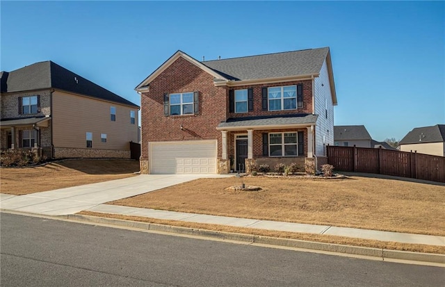3469 English Elm Way, Loganville, GA 30052 - view of front of property with fence, an attached garage, driveway, a front yard, and brick siding