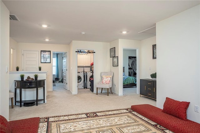 3469 English Elm Way, Loganville, GA 30052 - interior space featuring washing machine and clothes dryer, visible vents, recessed lighting, attic access, and light colored carpet