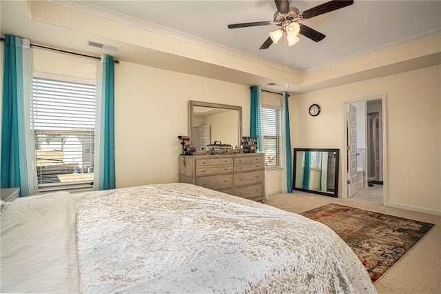 3469 English Elm Way, Loganville, GA 30052 - bedroom featuring a tray ceiling, visible vents, crown molding, and light colored carpet