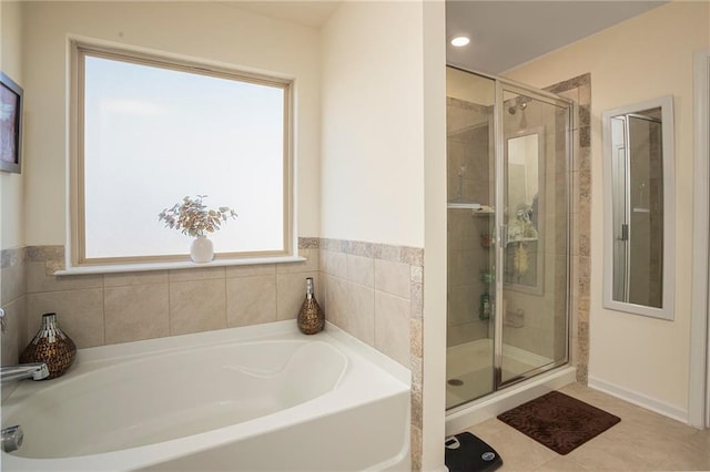 3469 English Elm Way, Loganville, GA 30052 - bathroom with a shower stall, tile patterned flooring, and a garden tub