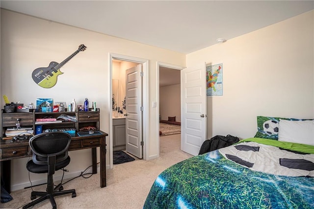 3469 English Elm Way, Loganville, GA 30052 - bedroom with connected bathroom and light carpet