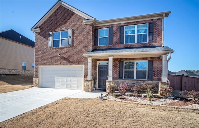 3469 English Elm Way, Loganville, GA 30052 - view of front facade featuring driveway, a front yard, fence, an attached garage, and brick siding