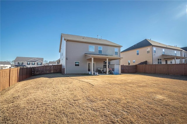 3469 English Elm Way, Loganville, GA 30052 - back of house with a fenced backyard, a patio area, and a yard