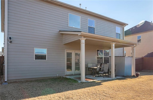 3469 English Elm Way, Loganville, GA 30052 - rear view of property with a yard, fence, and a patio area