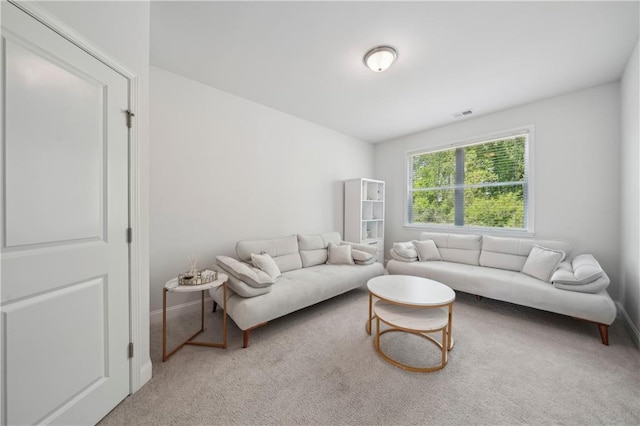 living room with baseboards, carpet, and visible vents