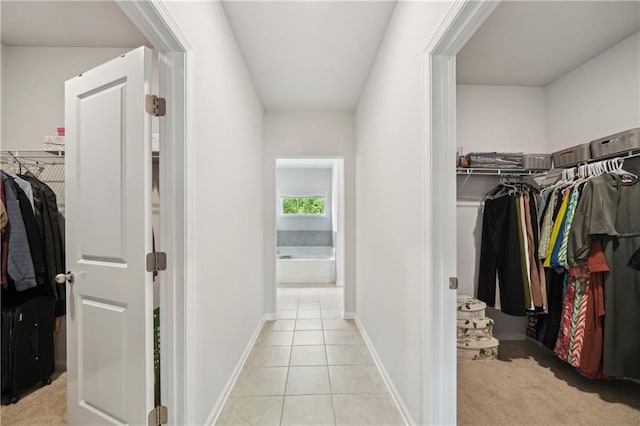 spacious closet with light tile patterned flooring