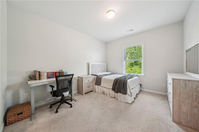 bedroom featuring light colored carpet, baseboards, and visible vents