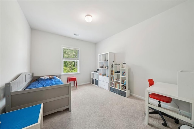 carpeted bedroom featuring baseboards and visible vents