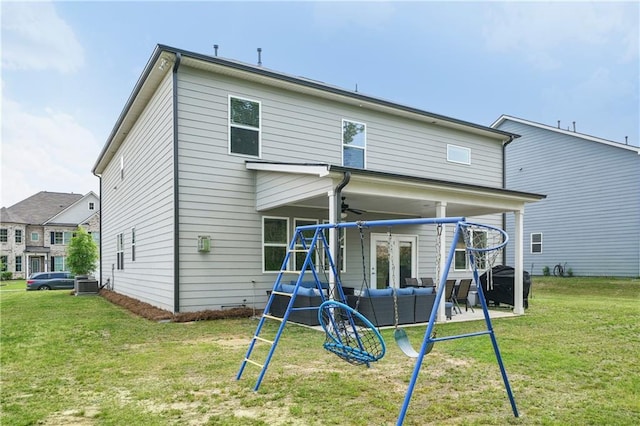 back of house featuring ceiling fan, a patio area, central air condition unit, an outdoor hangout area, and a yard