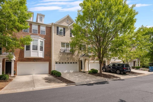 townhome / multi-family property featuring a garage