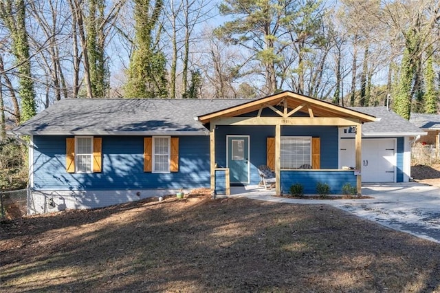 view of front facade featuring a porch and a garage