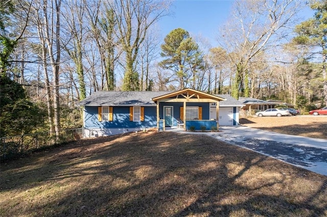 ranch-style home with a porch and a garage