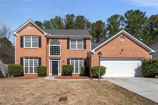 colonial-style house with brick siding, driveway, an attached garage, and a front lawn