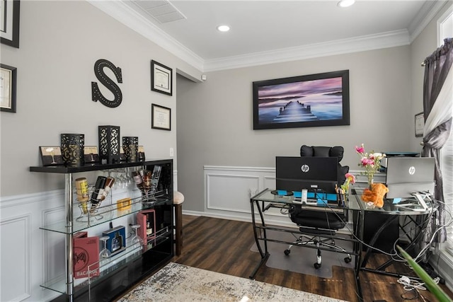 office featuring a wainscoted wall, wood finished floors, ornamental molding, and a decorative wall